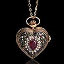 Montre pendentif collier coeur avec incrustation de pierre précieuses et chaine à maillons