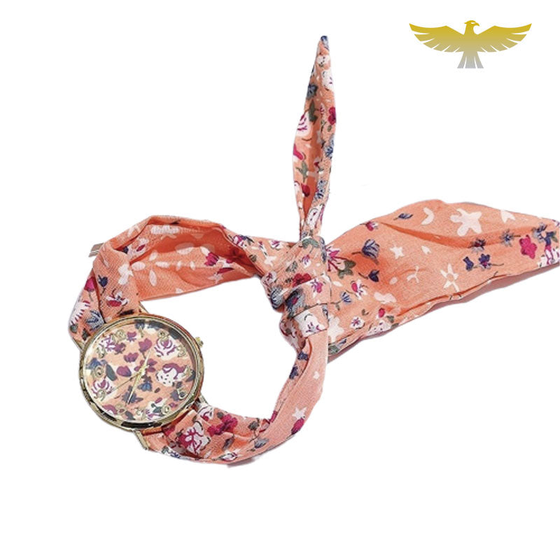 Montre foulard rose à fleurs blanches